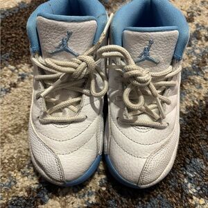 Kid White and Blue Jordan 12’s